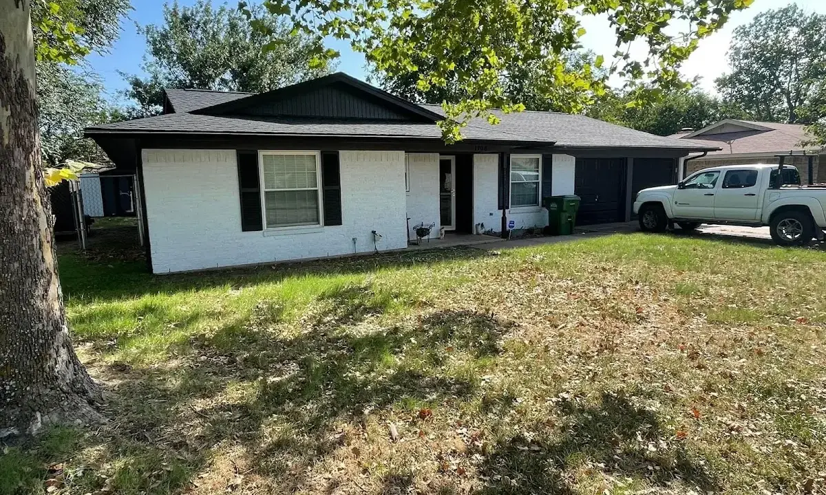 Professional roofing crew working on a residential roof in Jackson